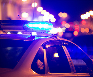 Police car in a city at night