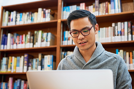 Student studying on laptop