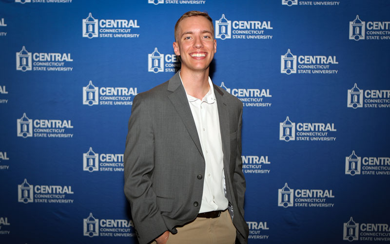 Jacob Deschaine in front of Central Backdrop