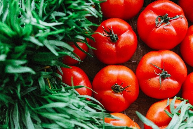 Produce image of tomatoes and greens