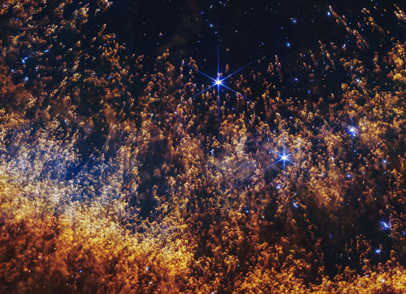 This new image of a portion of the Helix Nebula from NASA’s James Webb Space Telescope highlights comet-like knots shaped by fierce stellar winds and layers of gas and dust shed off by a dying star interacting with its surrounding environment. Webb’s image also shows the stark transition between the hottest gas to the coolest gas as the shell expands out from the central white dwarf.  Image: NASA, ESA, CSA, STScI; Image Processing: Alyssa Pagan (STScI)