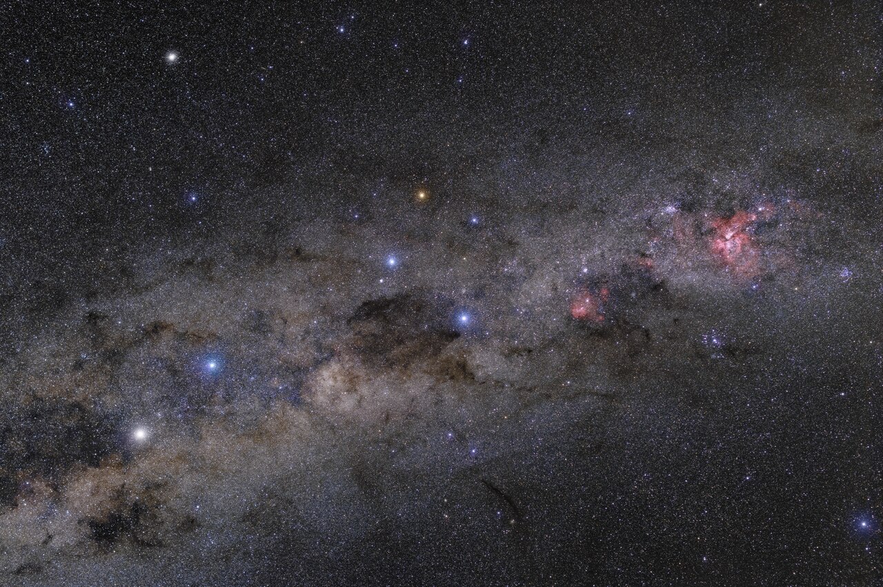 Part of the southern Milky Way, around the constellations of Centaurus, Crux and Carina. In the center of the image, the majestic Southern Cross (Crux) constellation, symbol of ESO, takes the central stage with dark Coalsack Nebula close by. On the left, brightest stars of Centaurus can be seen with theit typical colours. The brighter one is Alpha Centauri, one of the closest stars to our Sun. Right part of the view belngs to prominent Carina Nebula, one of the most significant of its type in the whole sky.
