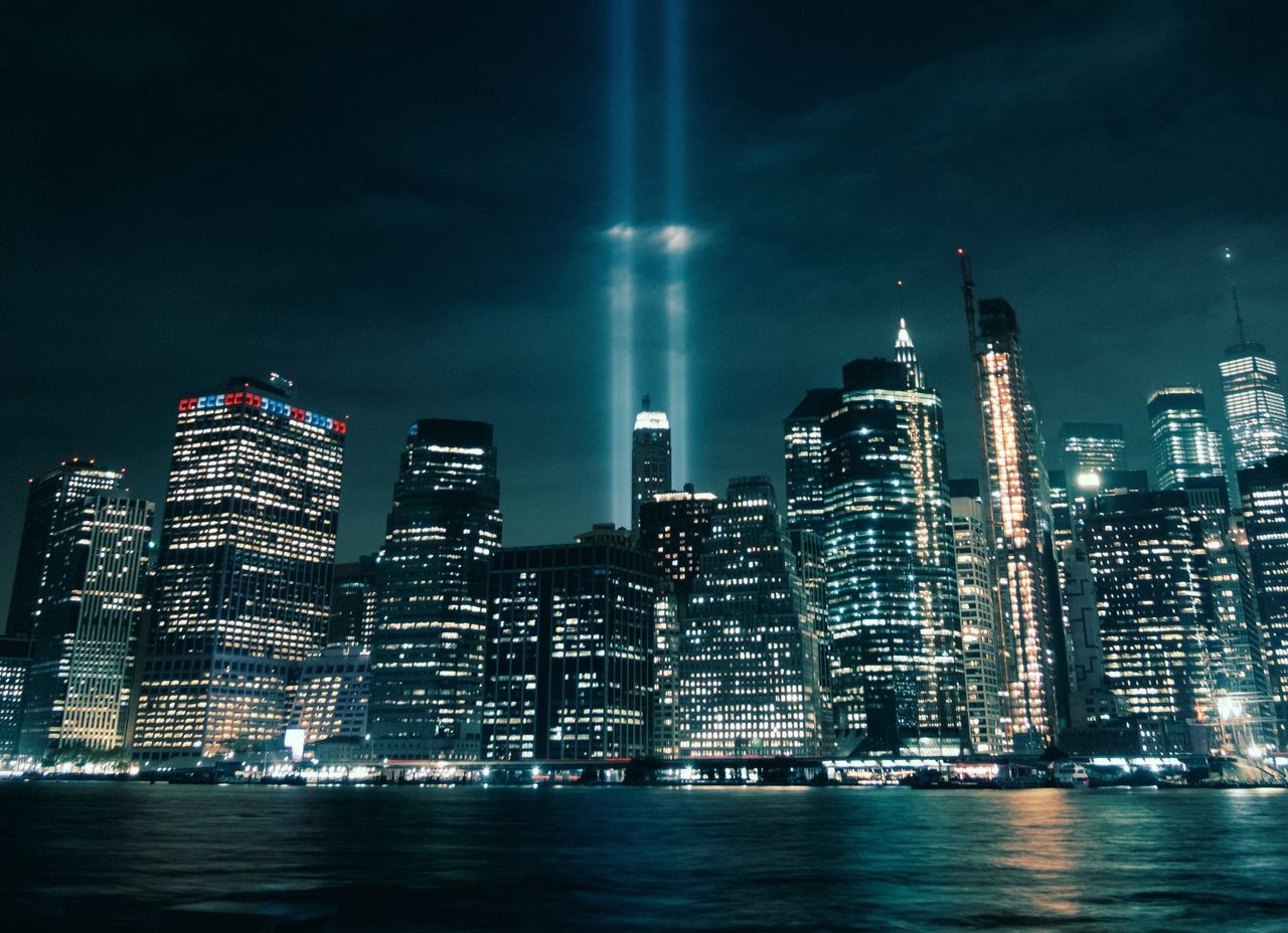 A dramatic shot of New York City's skyline featuring the Tribute in Light, captured at night. (Pexels)