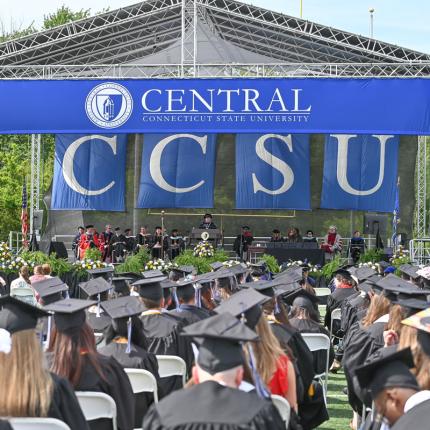 Stage and graduates at commencement