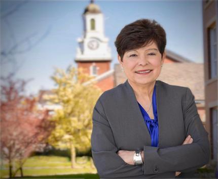 President Toro in front of Davidson Hall