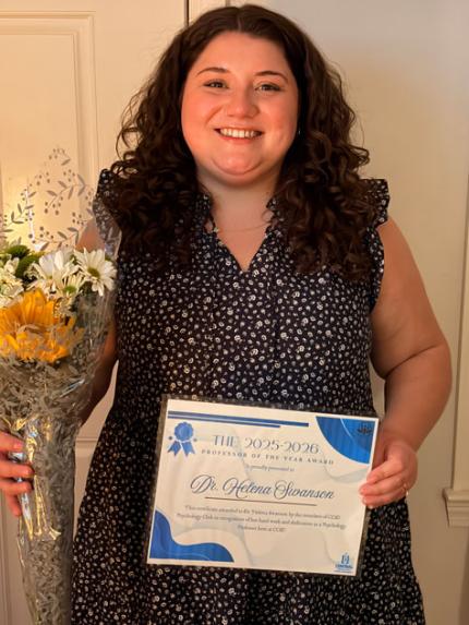 Helena Swanson holding award