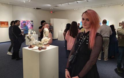 Art & Design students walking around exhibit 