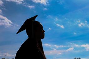 Graduate Silhouette in front of sky
