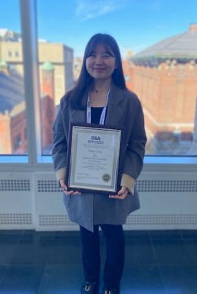 Image of Yein Cho holding Award