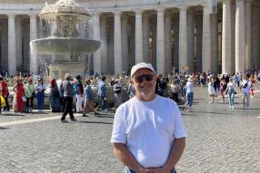 man in front of a fountain