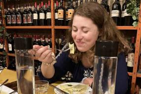 female student eating ravioli