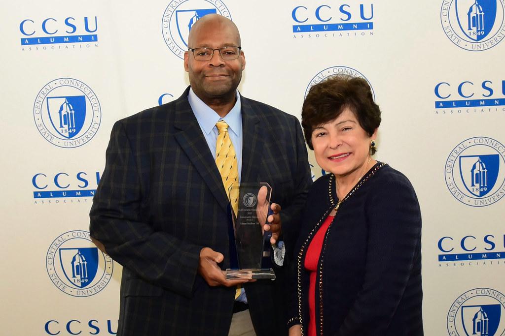 Community Service Award winner Omar McDew ’95 with President Toro