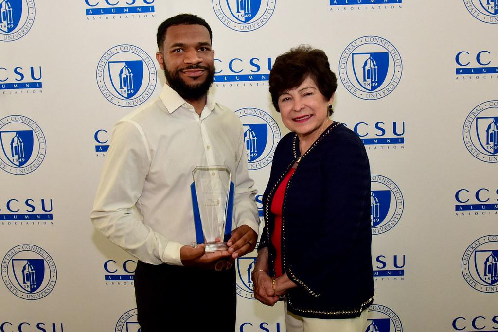 Young Alumni Service Award winner John Randolph ’13 with President Toro