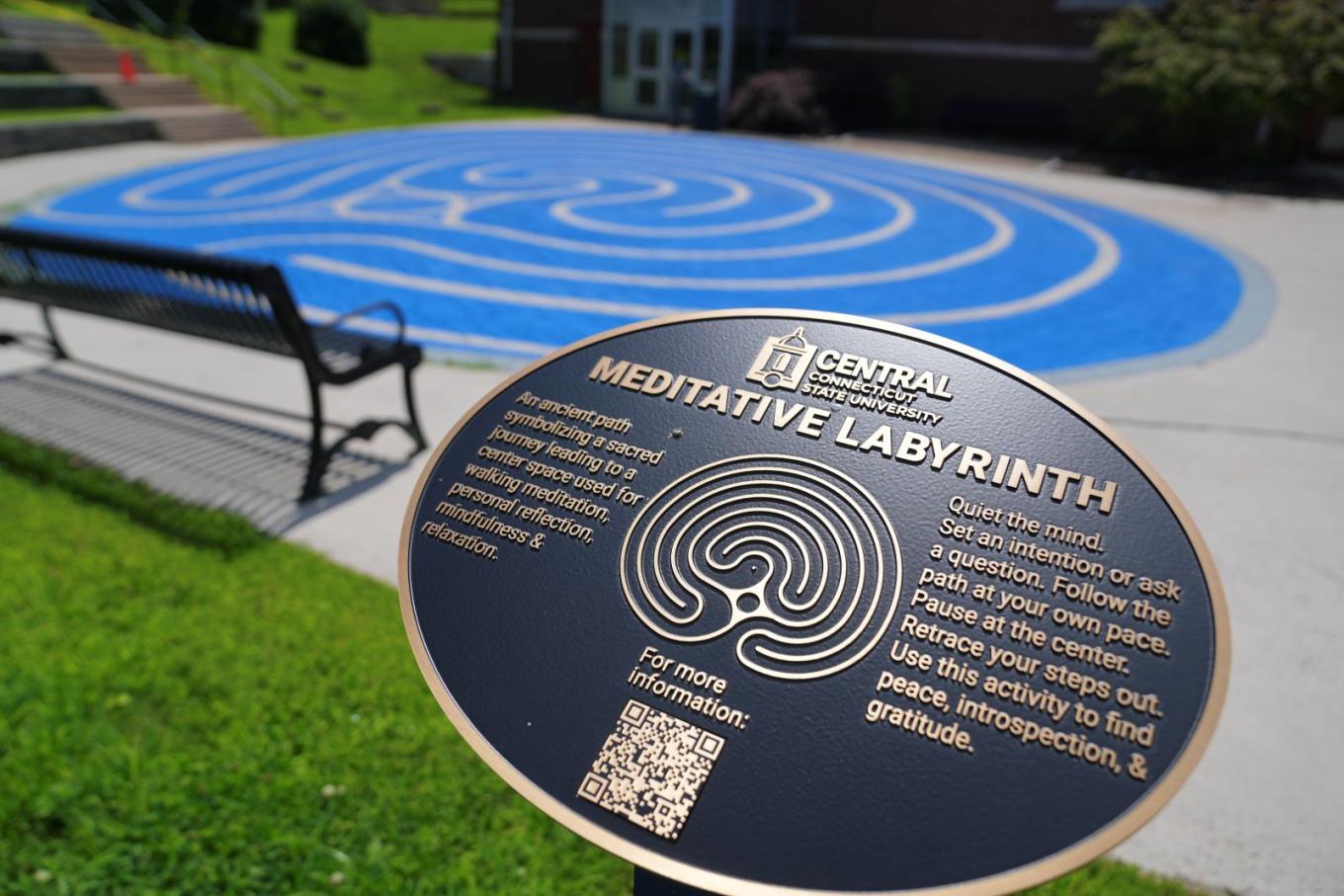 Signage in front of the Central Meditative Labyrinth explains the benefits of walking meditation.