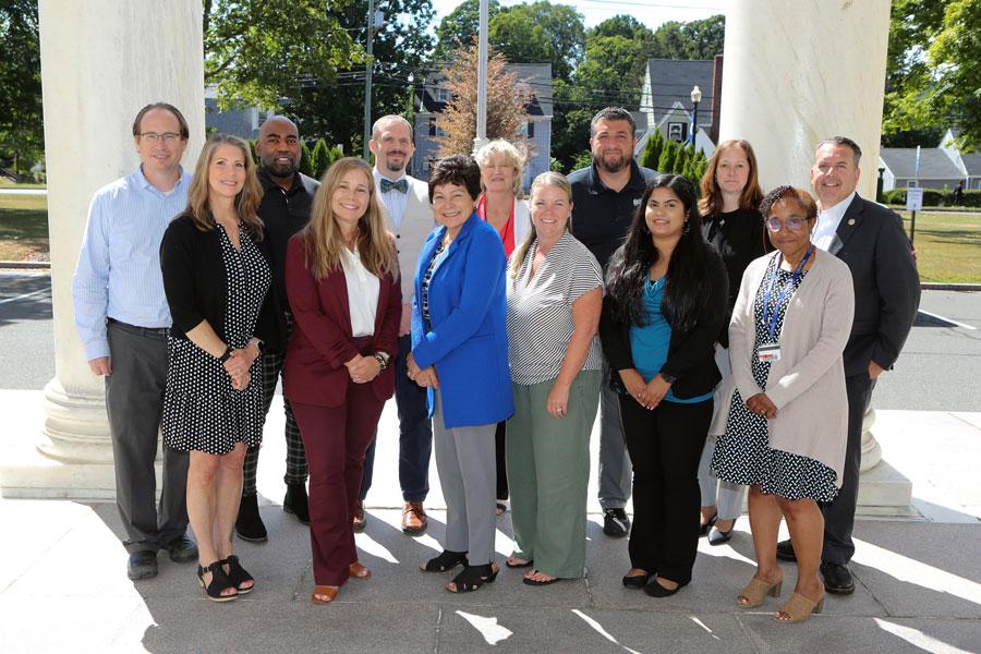 photo of group of people outside davidson hall