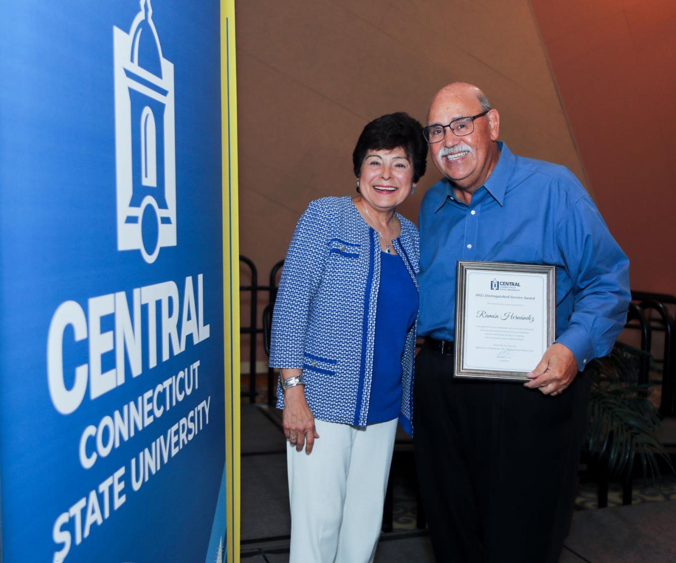 President Zulma Toro and Distinguished Service Award recipient Ray Hernandez
