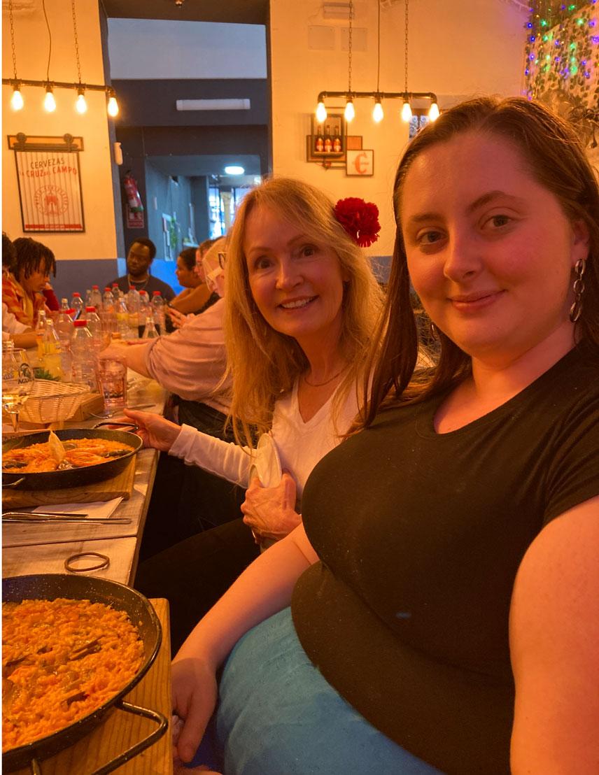 Student and teacher eating at a restaurant abroad