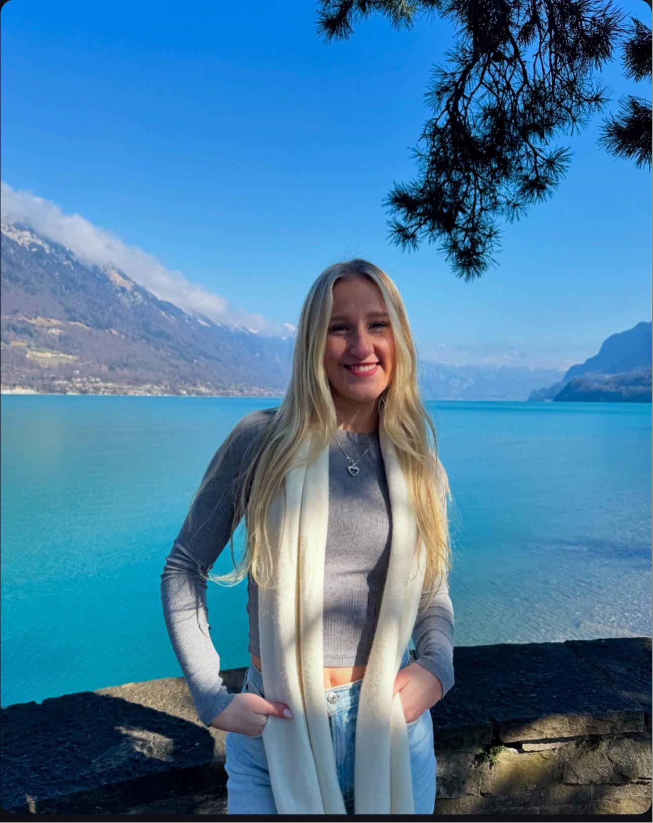 Nichole standing in front of lake in Italy