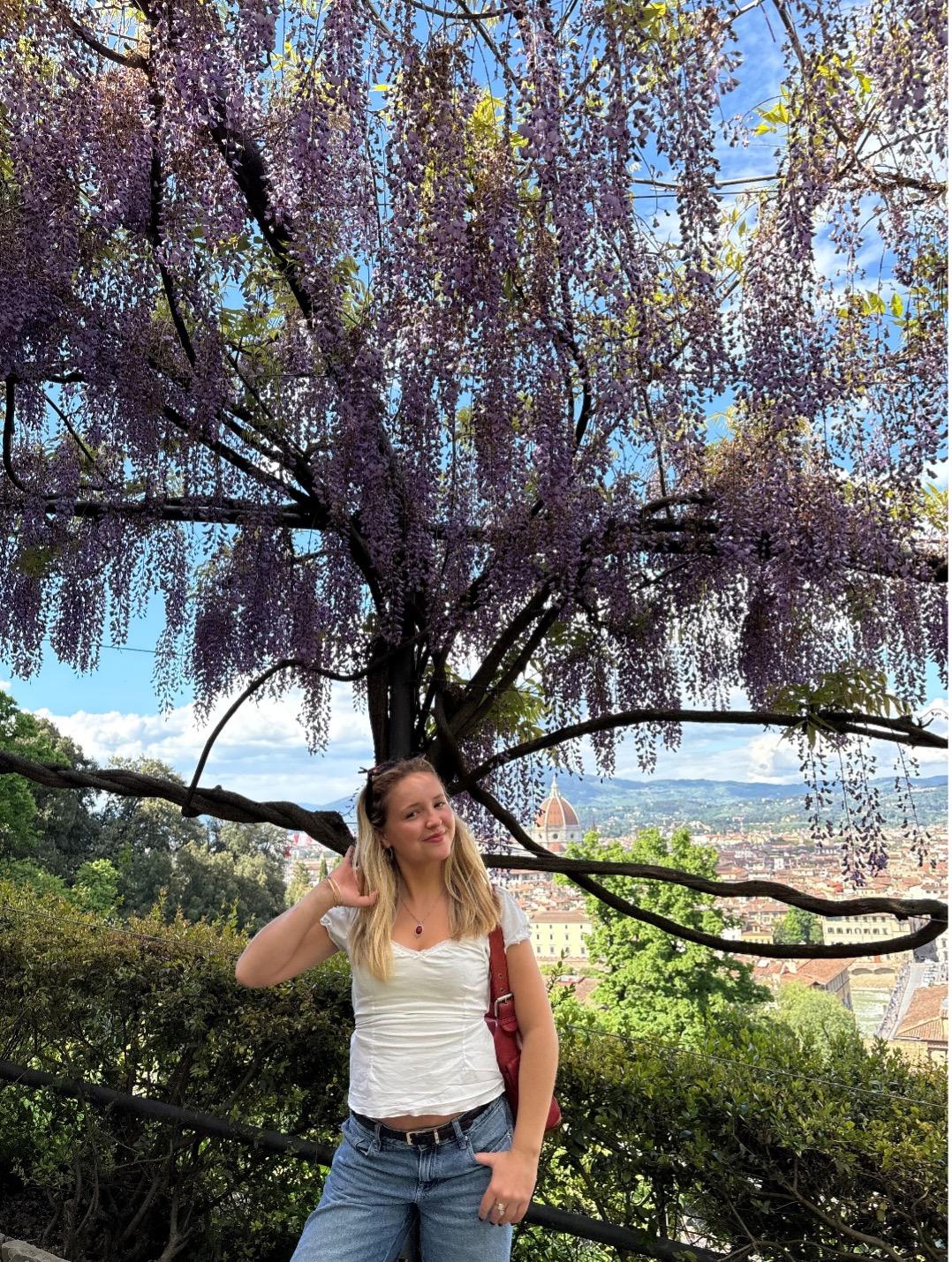 Olivia in front of tree