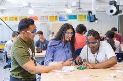 Students working on an electrical device