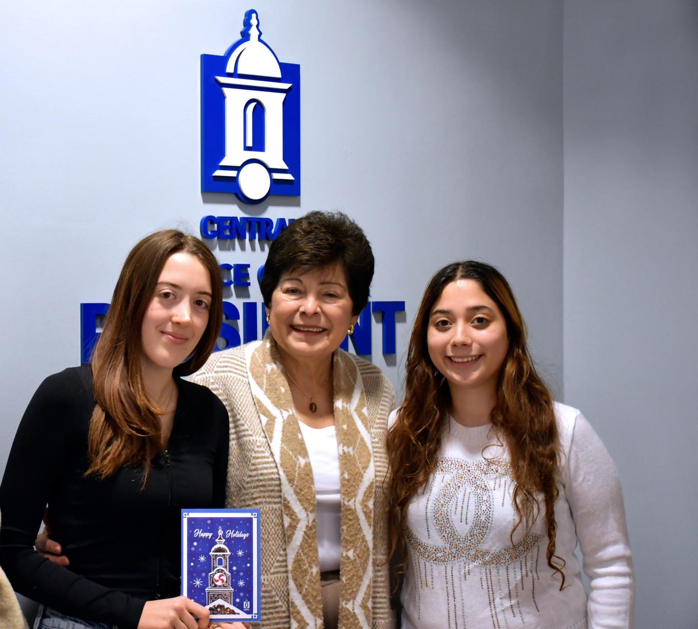 Alexia Strumi, Graphic Design Student Worker, Office of Marketing and Communications, President Zulma R. Toro, Emily Ramirez, Graphic Design Student Worker, Office of Marketing and Communications.