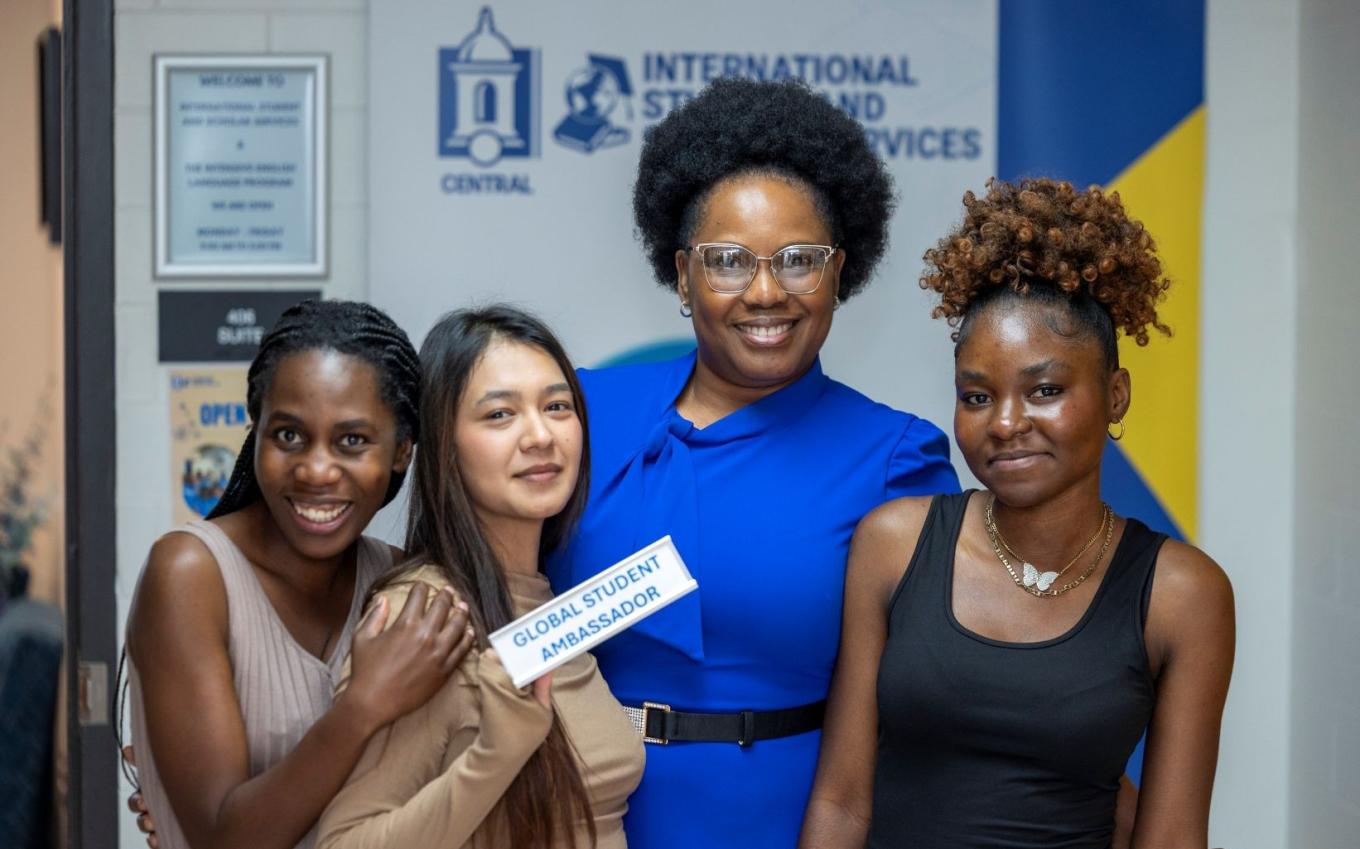 Oluwatoyin Awoderu greets some new international exchange students during an open house event on Oct. 1, 2025, at Barnard Hall. (Photo by John Henninger)