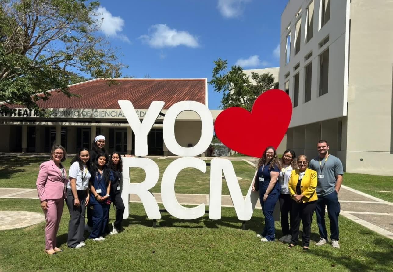 Central Nursing students and faculty stand outside of the University of Puerto Rico Medical Sciences campus in San Juan, Puerto Rico.