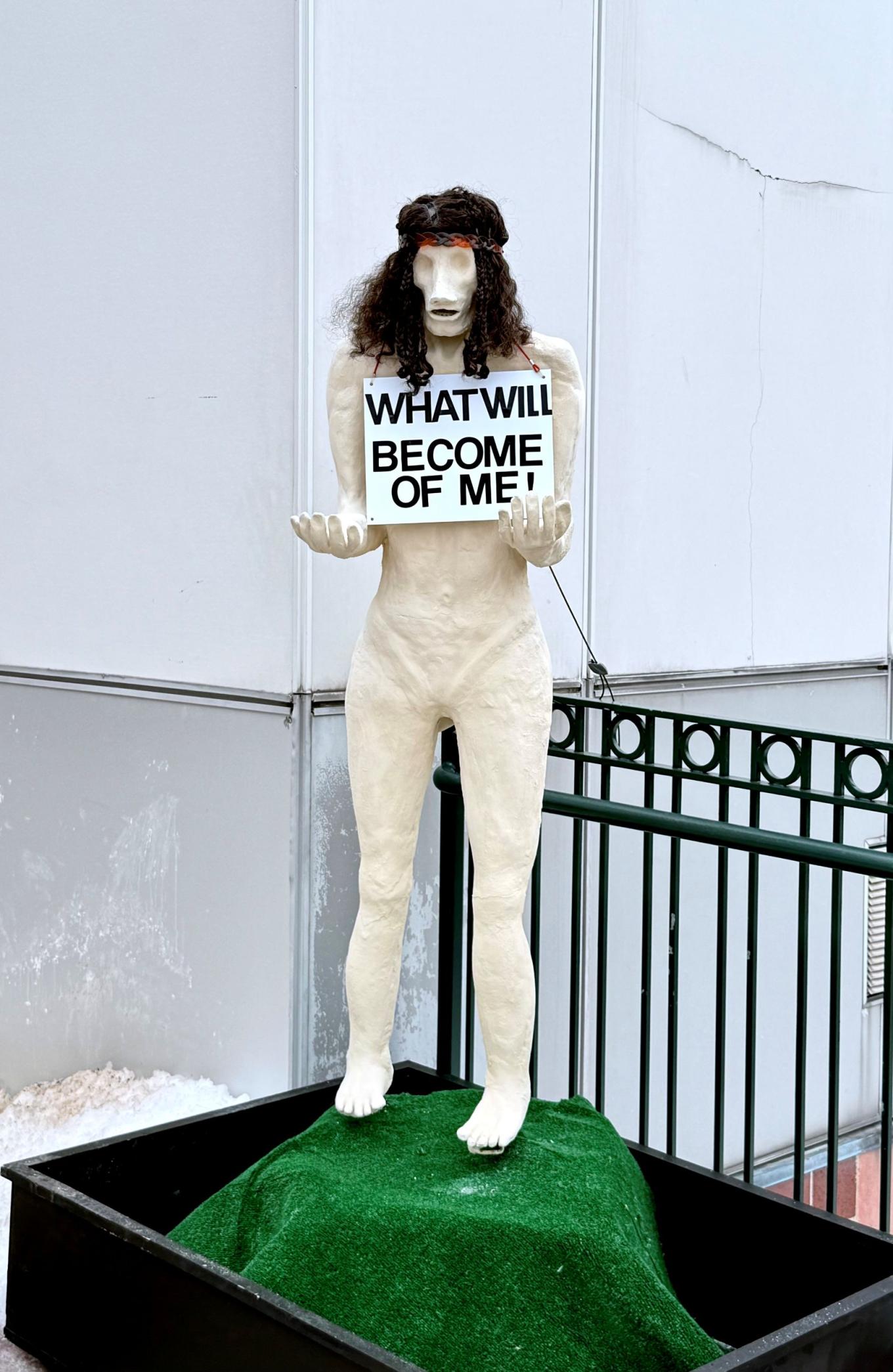 Tom Zaccheo's sculpture, constructed from approximately 250 pounds of unfired clay over a steel armature outside of Maloney Hall.