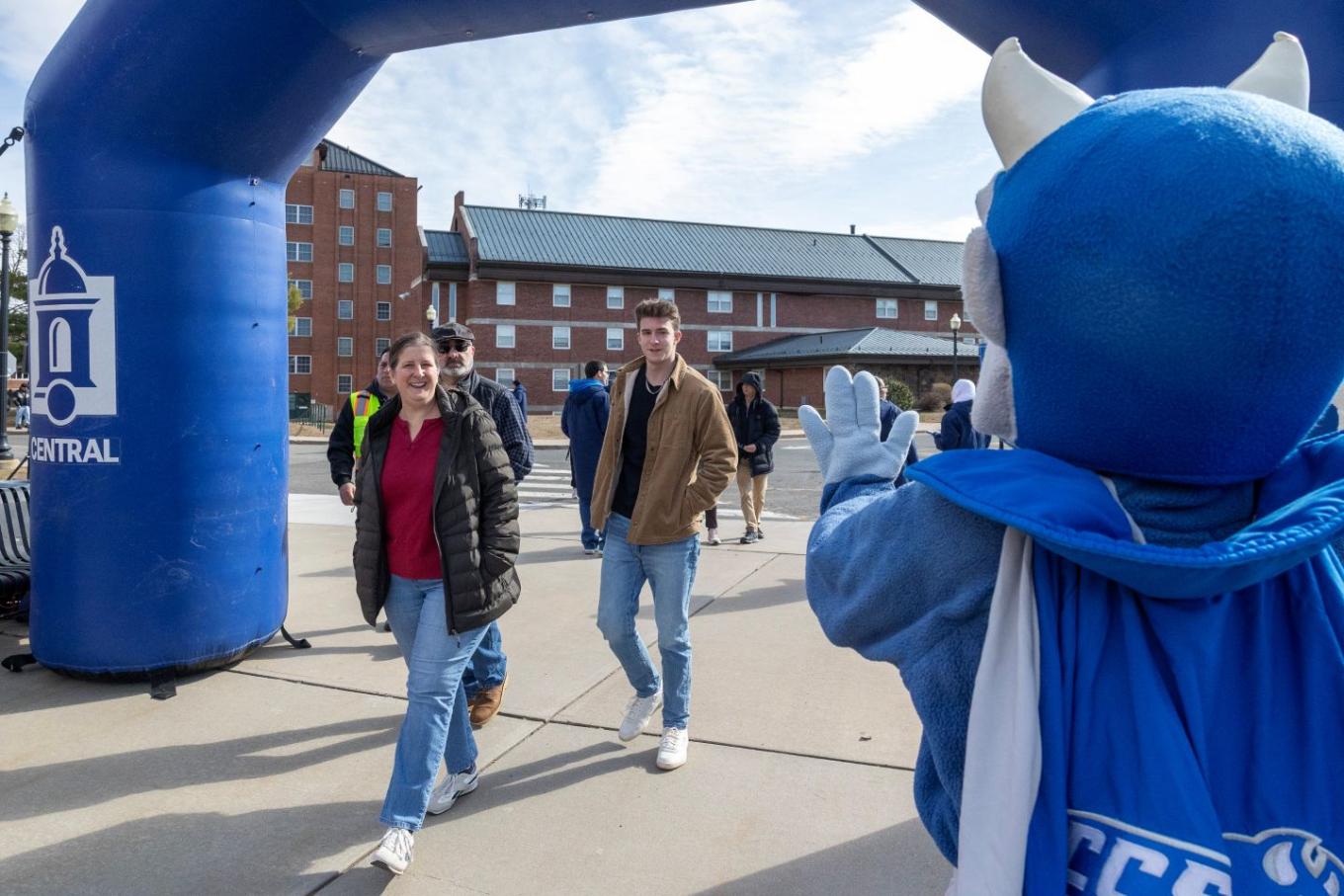 Guests approach a branded banner at Accepted Students Day on March 28.
