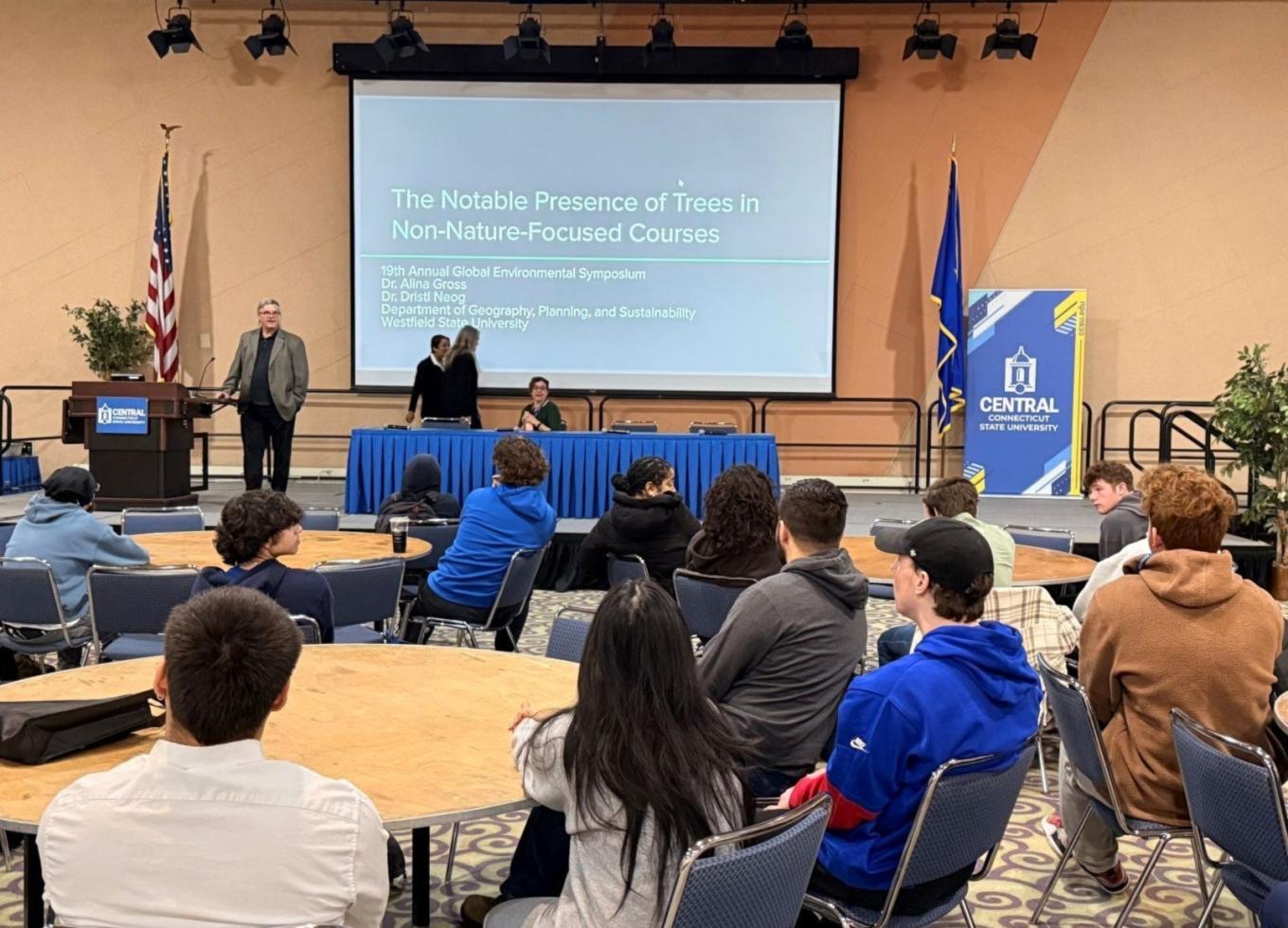 Students sit in Alumni Hall listening to a presenter during the 19th annual sustainability symposium at Central.