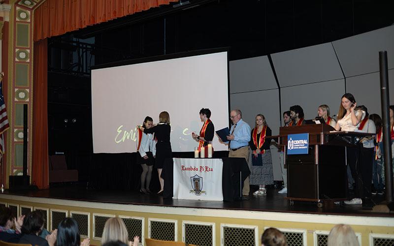 Emily Sousa receiving award