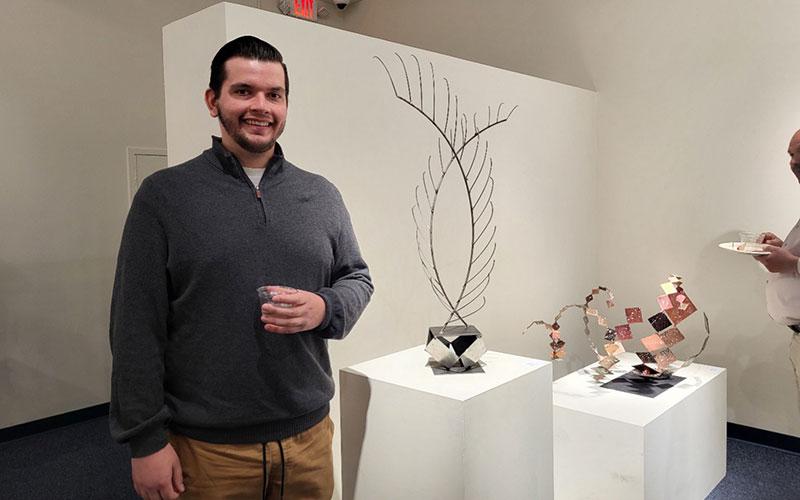 Art & Design student standing in front of art