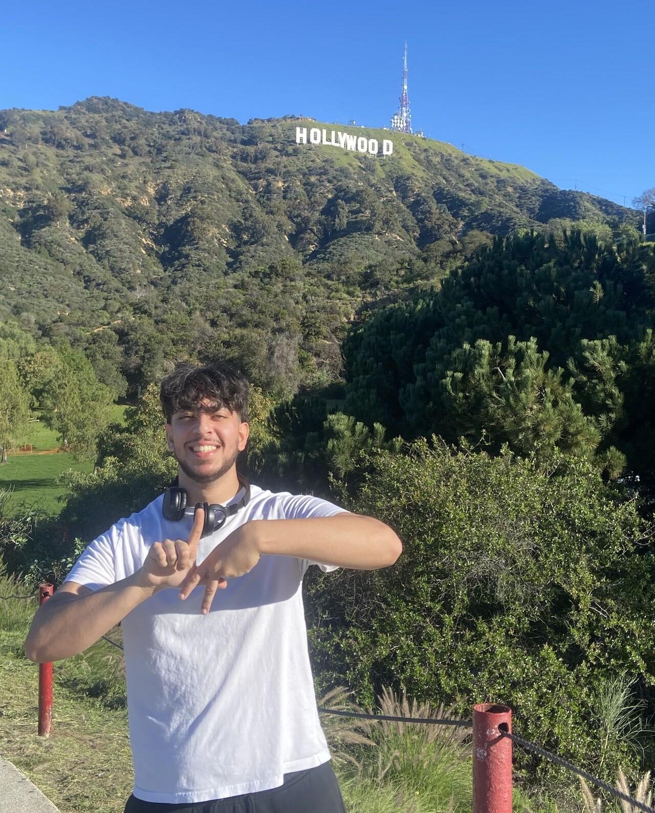 Exchange student Zakaria Butt is shown here in California with the Hollywood sign in the background.