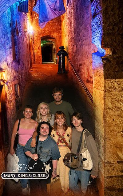 Group photo with vibrant colors in the background