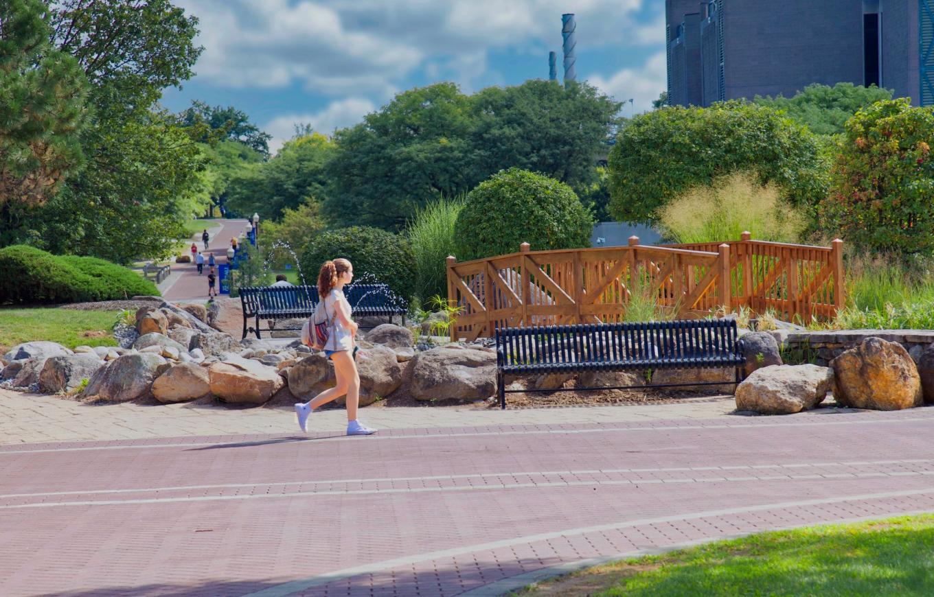 A student walks by the Sophomore Bridge installation at the Student Center Circle.