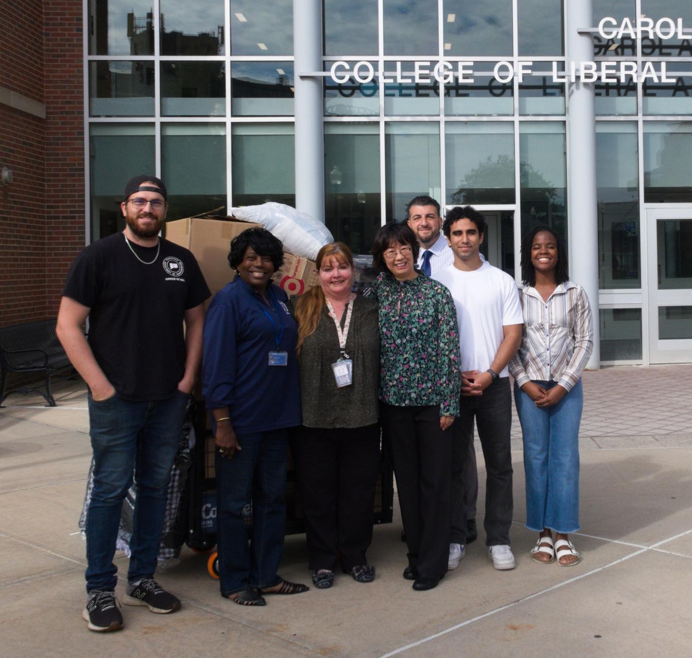 Central faculty, staff, and students pose for a group photo in front of Willard-DiLoreto Hall.