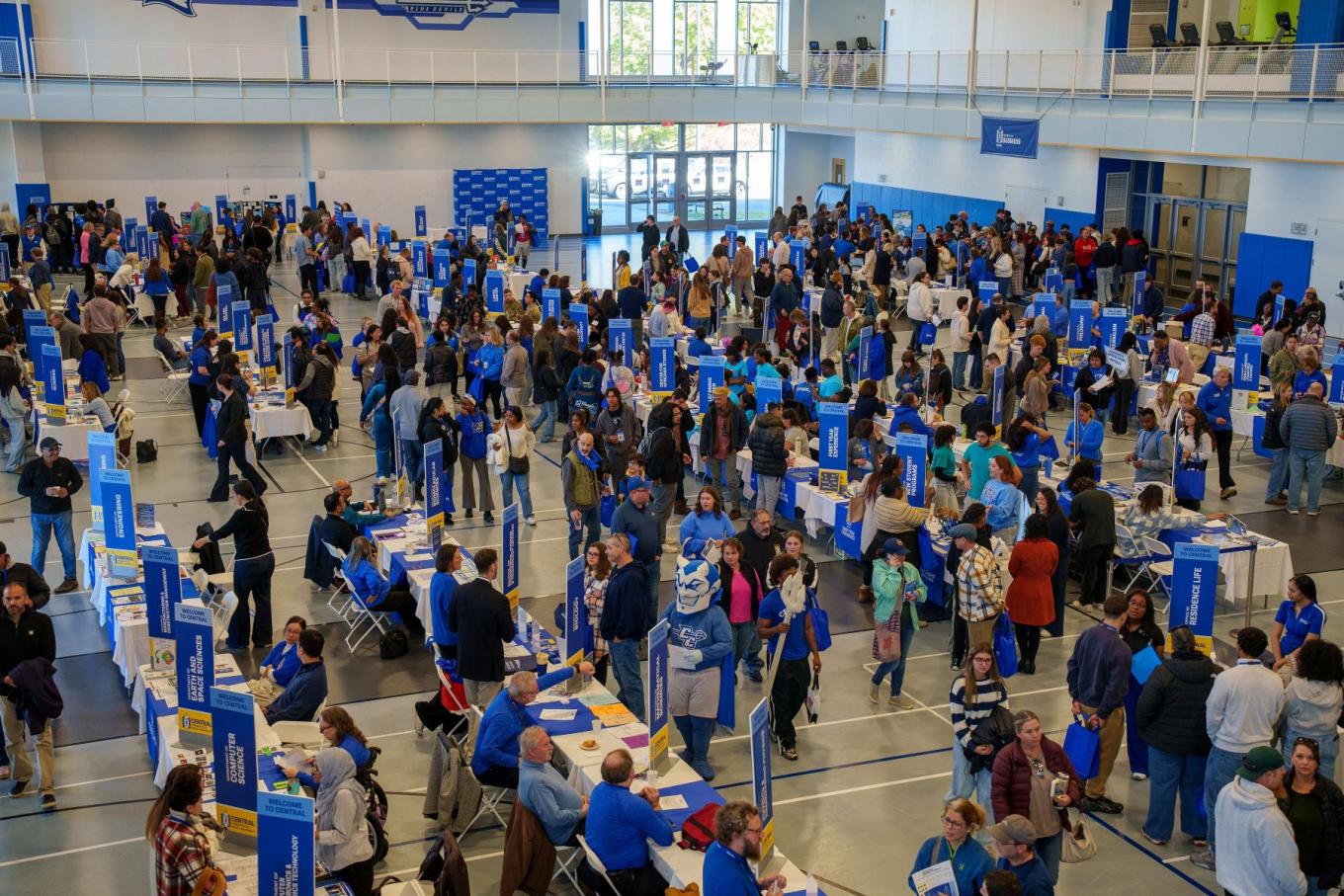 Visitors fill the Huang Recreation Center to learn more about academic, support, and student life options available at Central.