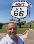 John Mitrano in front of route 66 sign