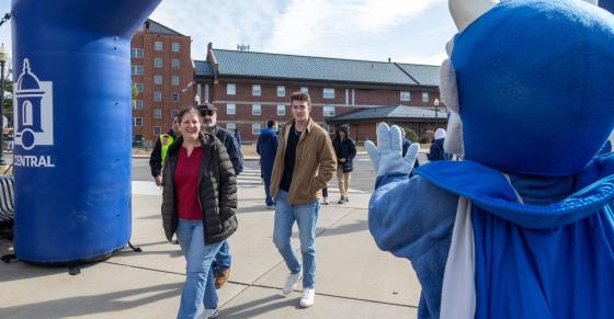Guests approach a branded banner at Accepted Students Day on March 28.