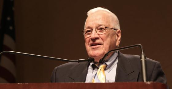 Richard Judd speaks behind a podium