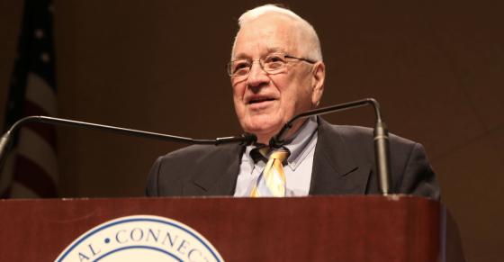 Richard Judd speaks behind a podium