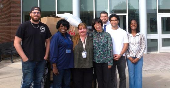 Central students faculty, and staff stand in front of Willard-DiLoreto Hall