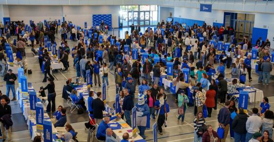 Visitors fill the Huang Recreation Center to learn more about academic, support, and student life options available at Central.