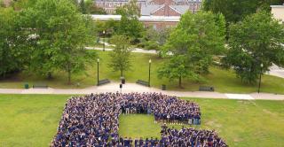 Students form the letter C on Vance lawn during Opening Day.