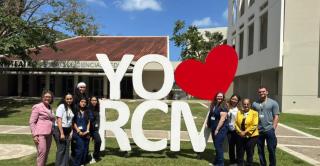 Central Nursing students and faculty stand outside of the University of Puerto Rico Medical Sciences campus in San Juan, Puerto Rico.