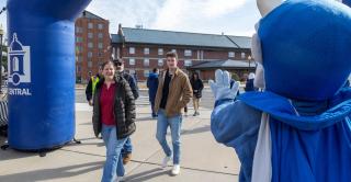 Guests approach a branded banner at Accepted Students Day on March 28.