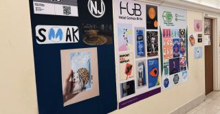 Communication student projects line a wall at Vance Academic Center