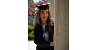 Portrait of Central student Kayla Beaulieu dressed in her cap and gown