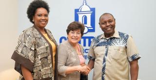 Oluwatoyin Awoderu, director of the Center for Africana Studies, President Zulma R. Toro, and Professor Peter Wanderi of Mount Kenya University pose for a group photo in Toro's office.