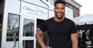 Dance Education instructor Lenard Foust in front of the Dance Education Center at Central.